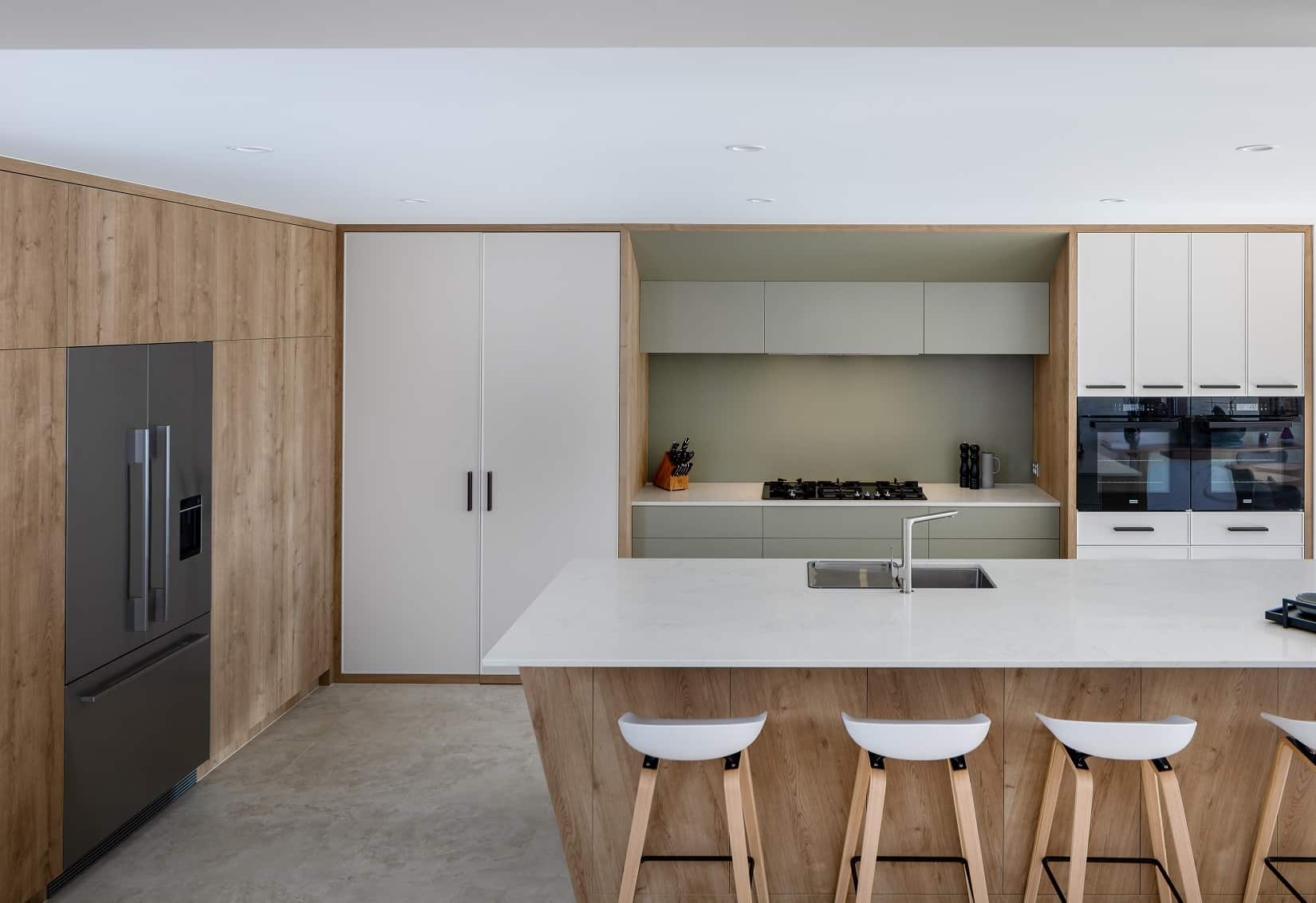 Kitchen using earthy tones with island bench