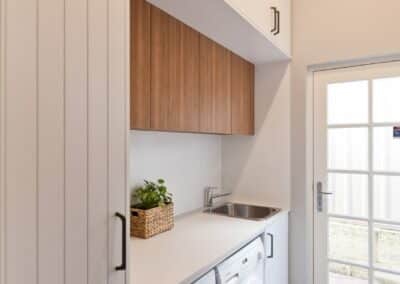 Storage space and laundry preparation bench