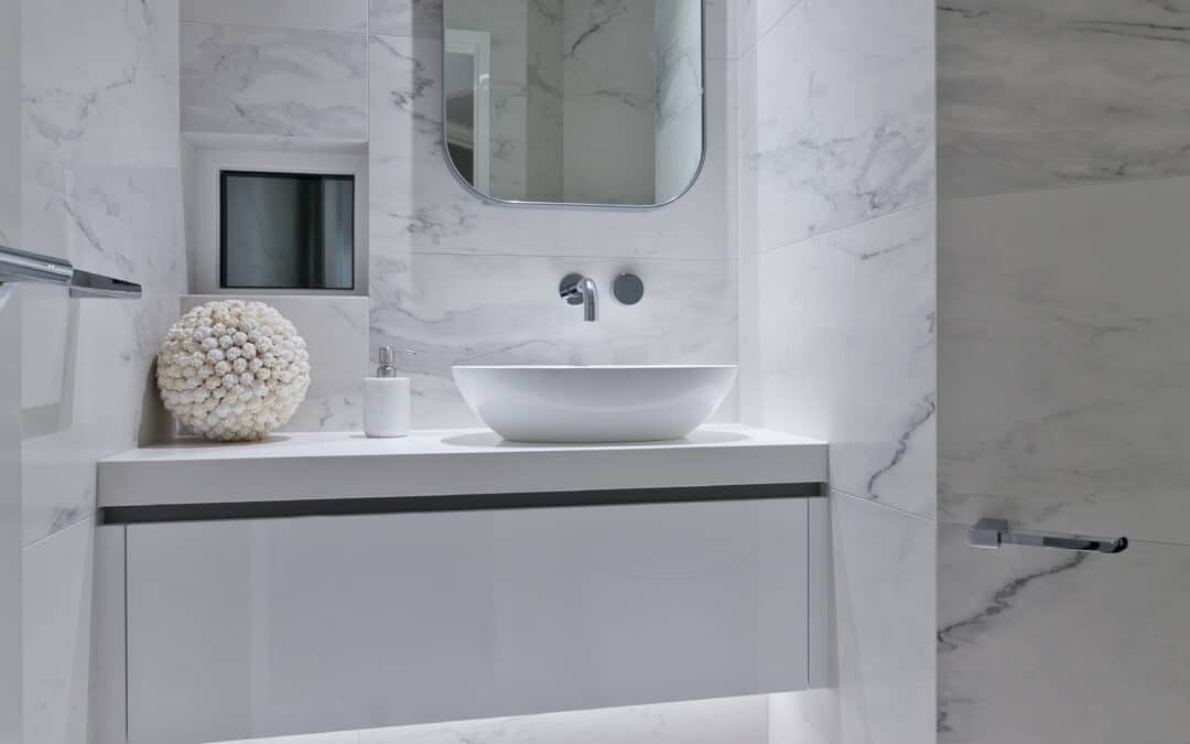 white bathoom vanity with marbled feature