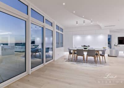 dining table with a view of outdoor setting and sunset