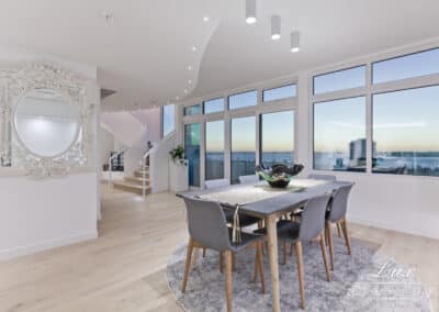 Dining area and staircase with view of south perth