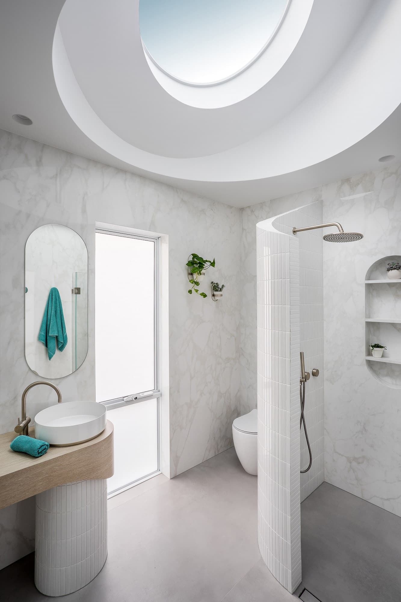 Curved skylight above bathroom