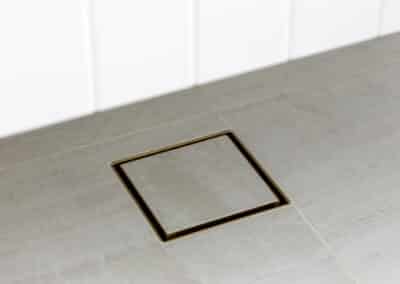North Beach Coastal Barn Bathroom with tile insert drain.