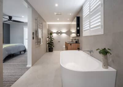 Scarborough ensuite overview of bath, vanity, smart toilet and lighting