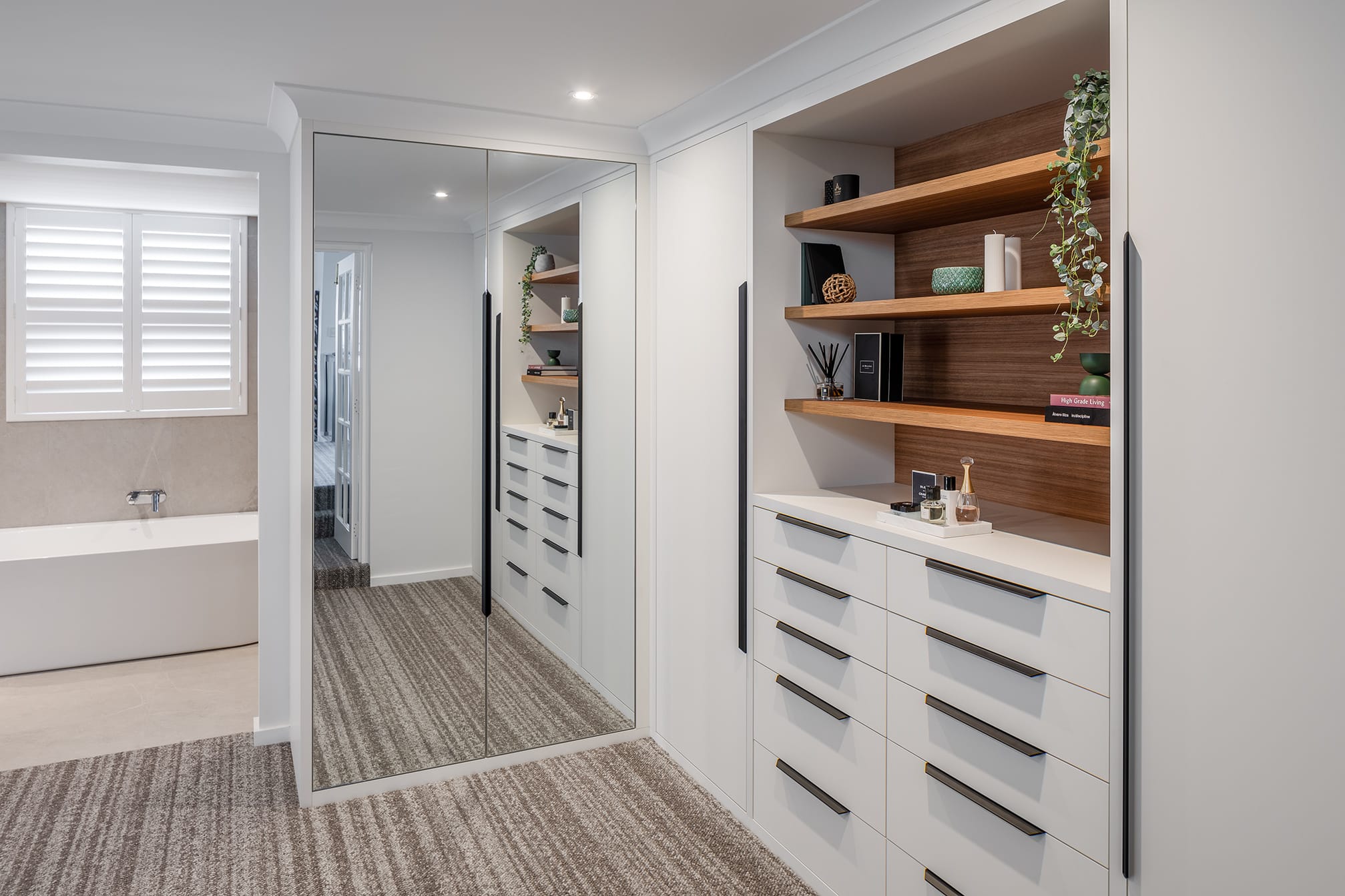 Scarborough Ensuite bedroom with custom cabinetry to surround bed head