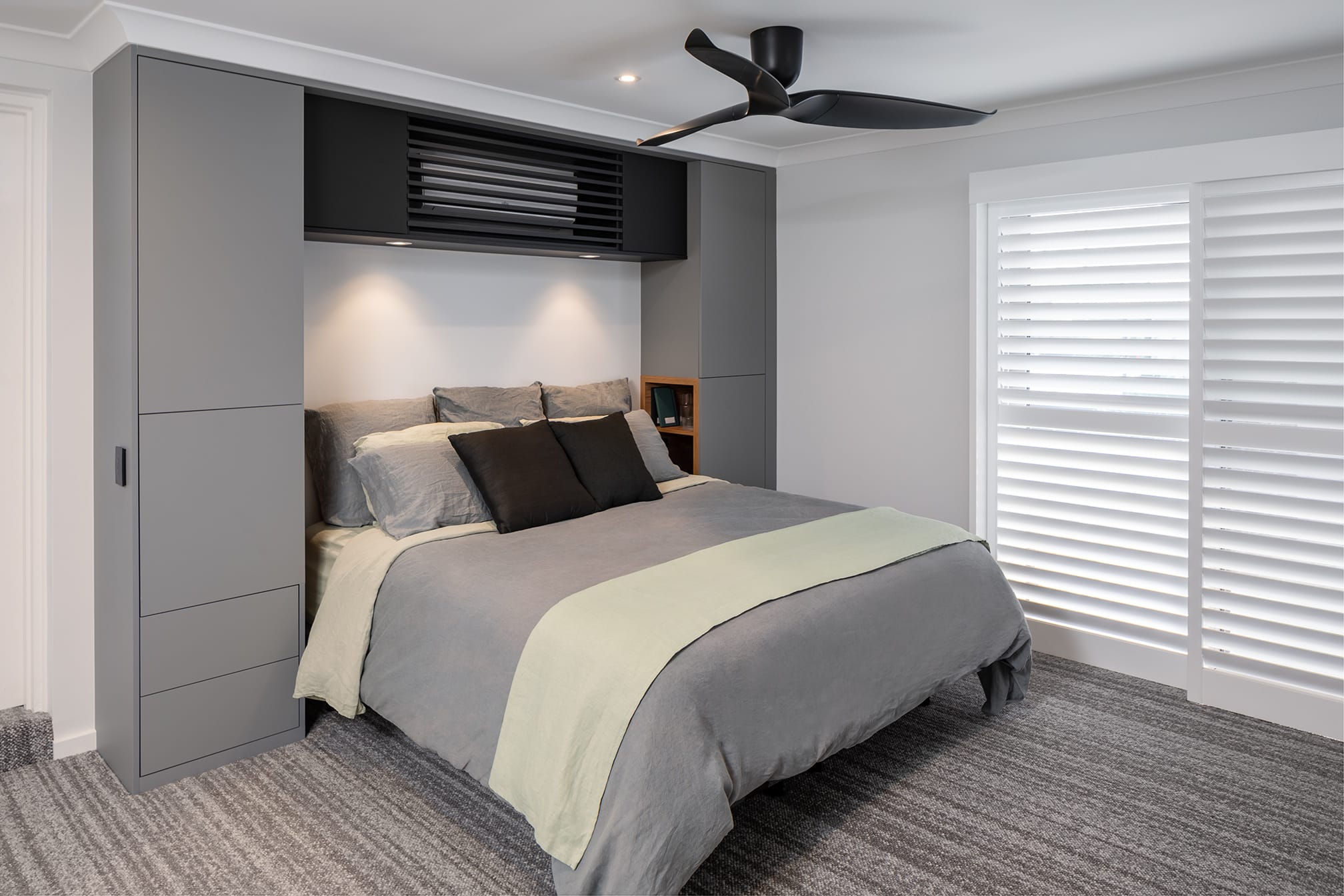 Scarborough Ensuite bedroom with custom cabinetry to surround bed head
