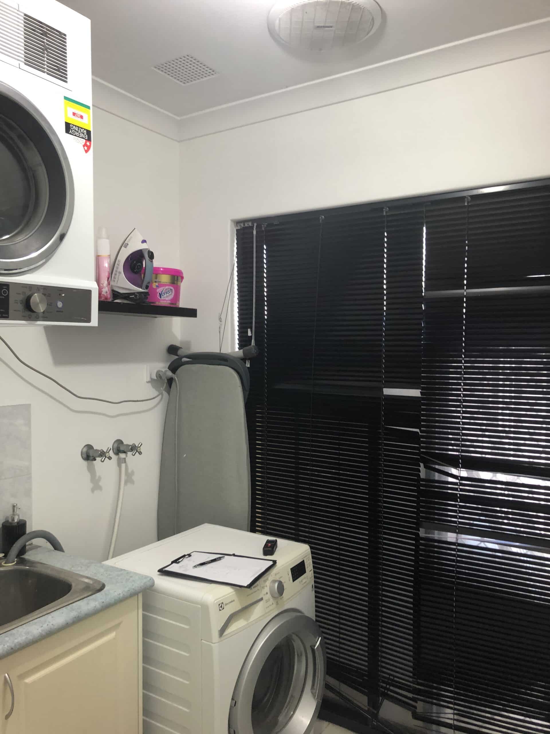 Monochrome Laundry before image, cluttered, no storage, no benchspace