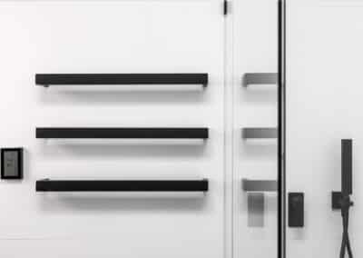 Monochrome Main Bathroom heated towel rails with timer