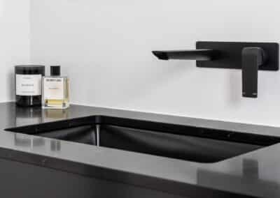 Monochrome ensuite black tapware black basin