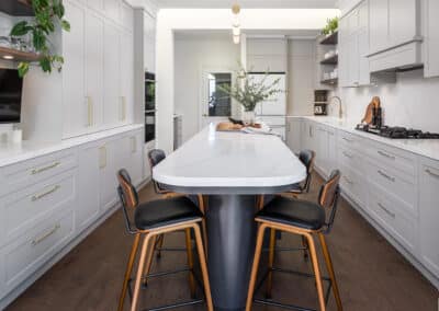 contemporary shaker style kitchen with curved island bench
