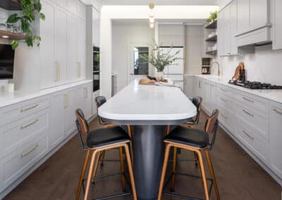 Contemporary shaker style kitchen with curved island bench