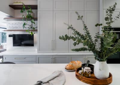 Contemporary shaker style kitchen with brass tapware and tall cabinetry