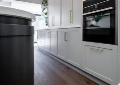 Contemporary shaker style kitchen with curved island bench