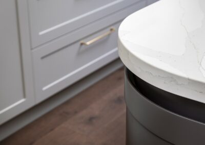 Contemporary shaker style kitchen with curved island bench