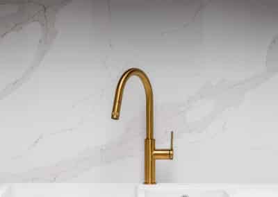 contemporary shaker style kitchen with brass tapware
