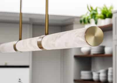 contemporary shaker style kitchen with brass feature pendant light