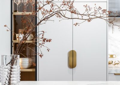 Contemporary kitchen with oak timber cabinetry, fluted glass, brass hardware and marble benchtops.