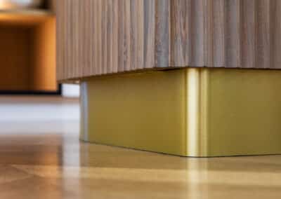 Brass kicker in kitchen cabinetry