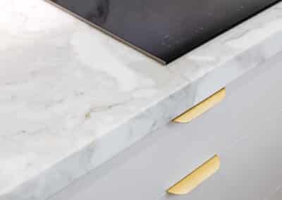 Marble benchtop with brass handles