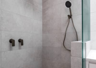 Contemporary ensuite renovation with brushed nickel tapware