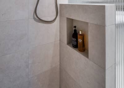 Contemporary ensuite renovation with shower niched in nib wall