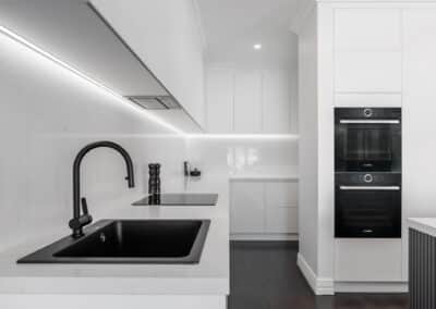 Black sink and mixer, monochrome kitchen, minimalist kitchen