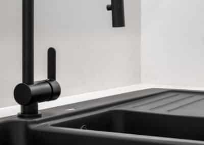 Black sink and mixer, monochrome kitchen, minimalist kitchen