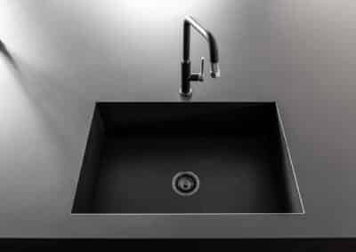 Industrial style kitchen renovation with integrated butler's sink