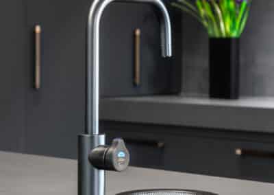 Industrial style kitchen renovation with brushed nickel Zip hyrdotap
