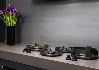 Industrial style kitchen renovation with cooktop integrated into the benchtop