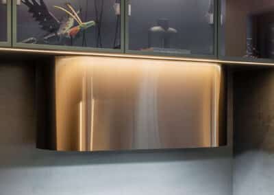 Industrial style kitchen renovation with bronze rangehood