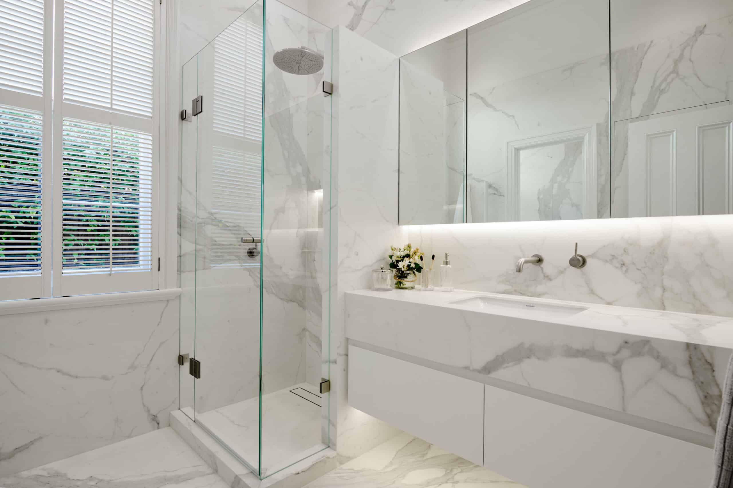 Minimalist contemporary marble look ensuite renovation