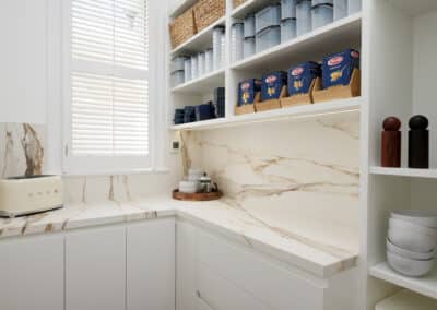 Riley project kitchen renovation with seamless minimalist cabinetry design and a marble look benchtop and splashback in butler's pantry