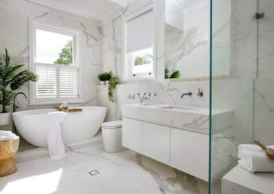 Contemporary marble look upstairs bathroom