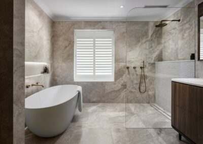 Mid-century modern contemporary ensuite renovation with free standing bath, open shower, walnut vanity