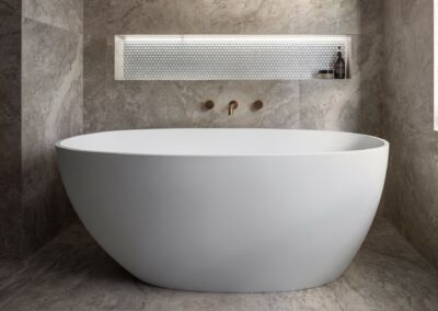 Mid-century modern contemporary ensuite reno with free standing bath, bronze tapware and recessed niche