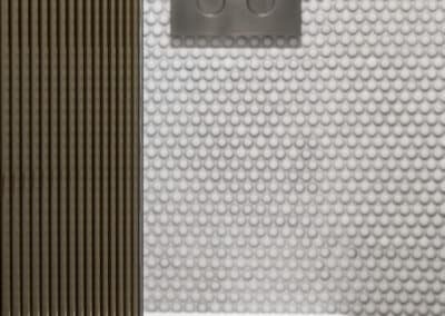 Bronze reeded glass screen door for toilet enclosure with brushed nickel flush button